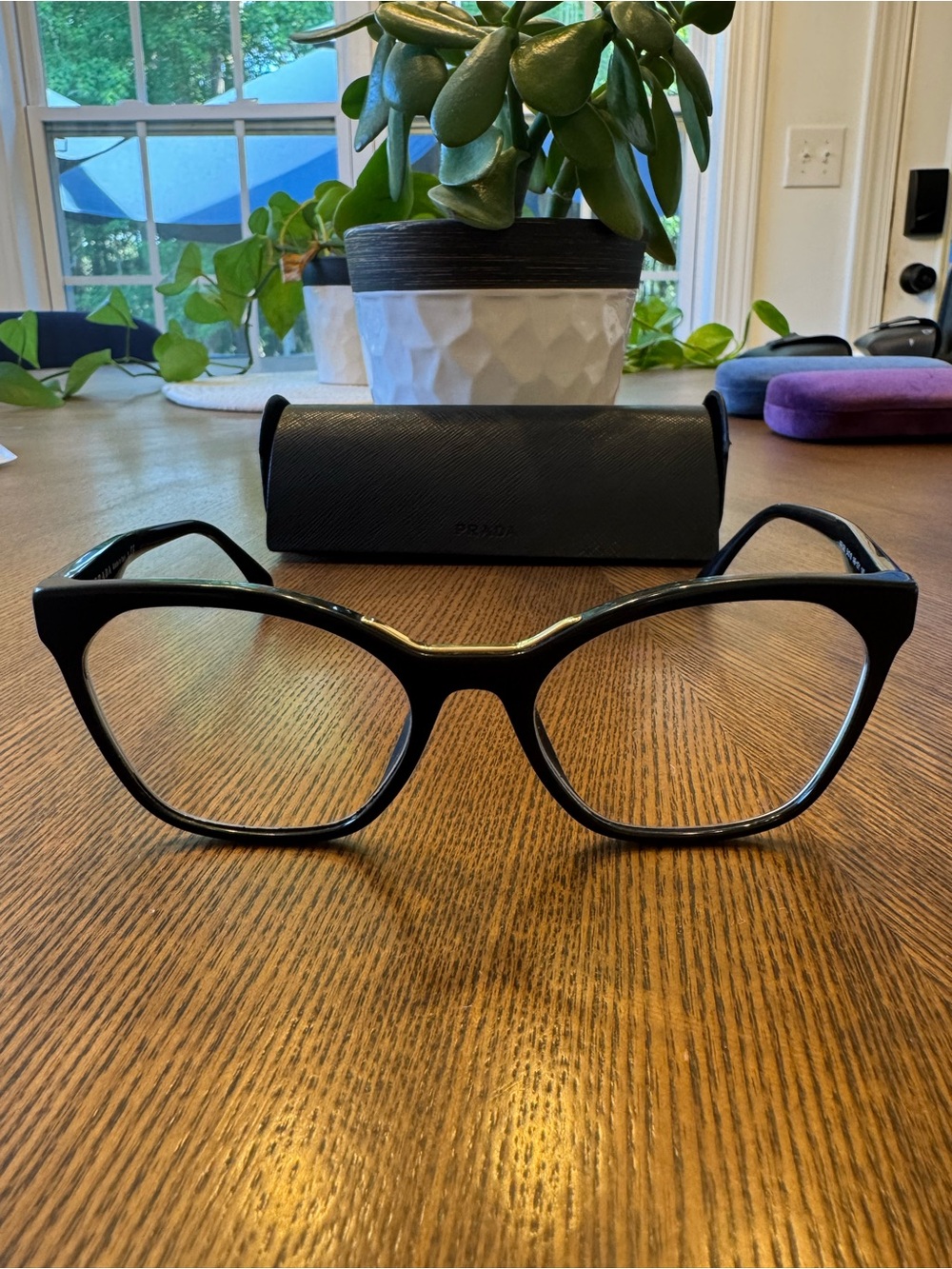 Prada Black Cat-Eye Glasses with Gold Bridge